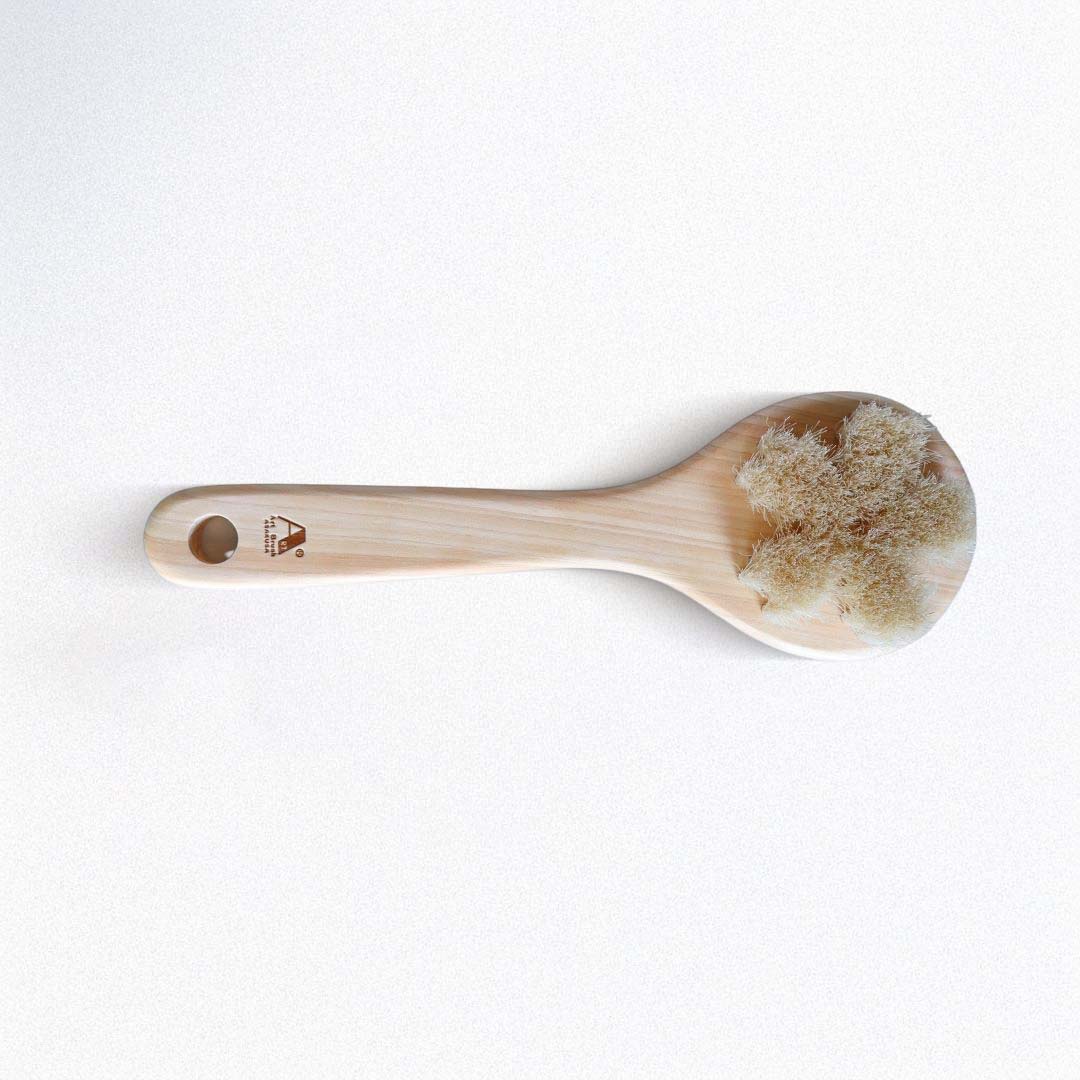 Wooden spoon with a natural finish on a white background
