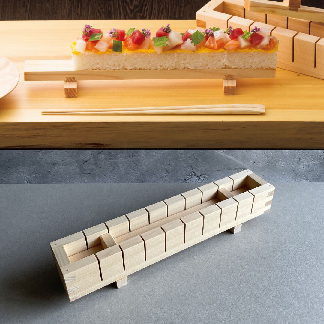 on the top, pressed sushi on a wooden tray and next to the mold and under it a wooden sushi mold in a grey room