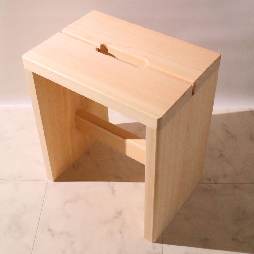 Wooden stool on a tiled floor