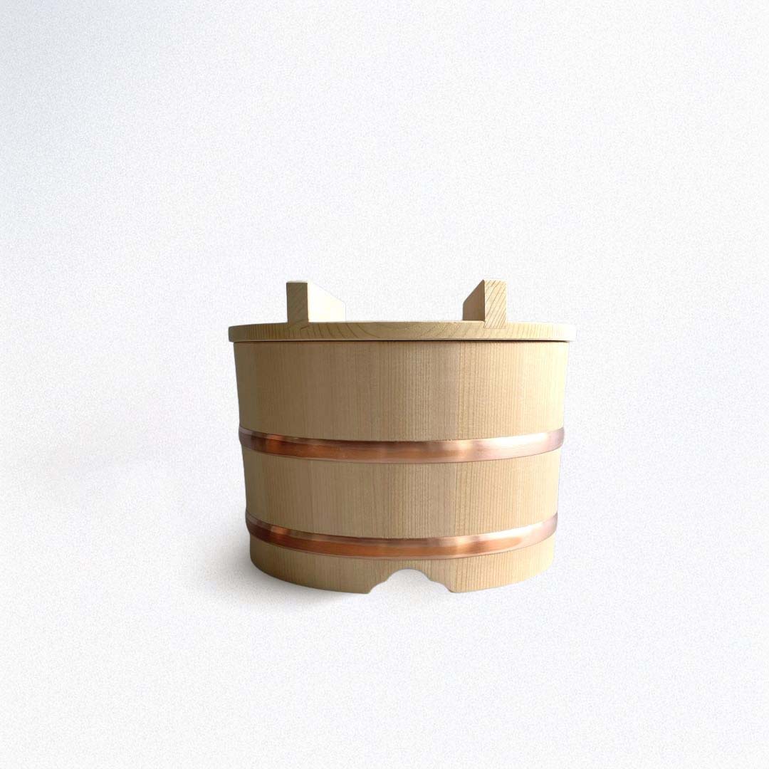 A wooden rice bucket on a white background