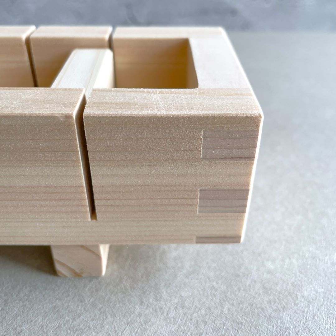 A close view of a wooden sushi box 