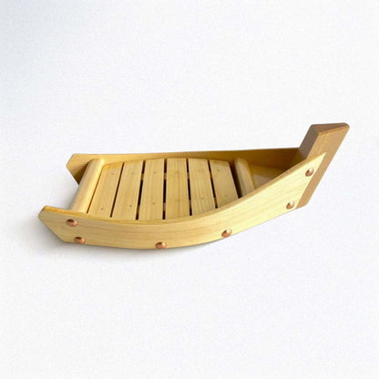 Wooden boat for sushi on a white background