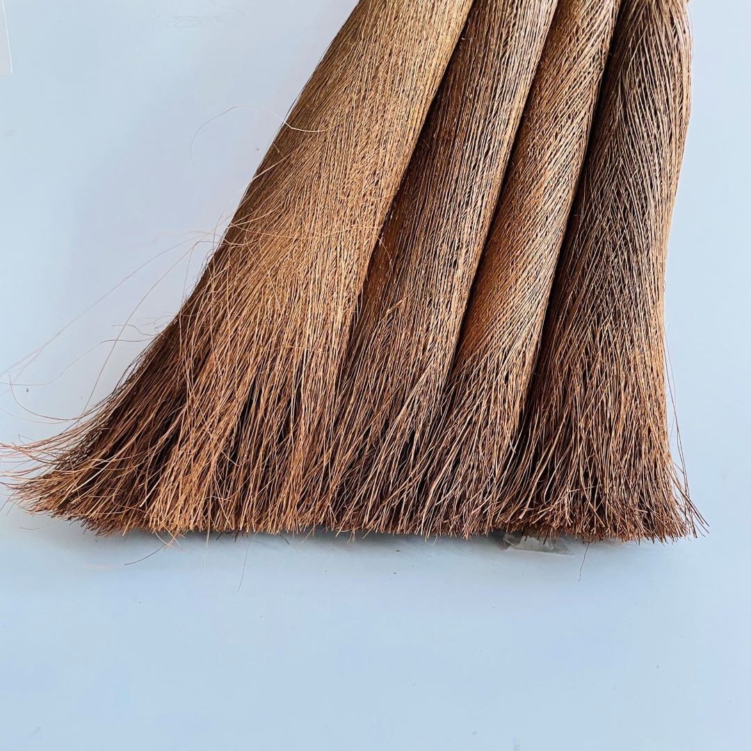 brown hemp broom in a grey background