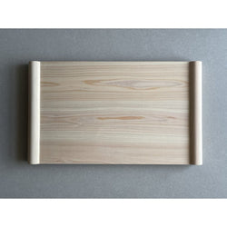 Wooden cutting board front view on a grey surface