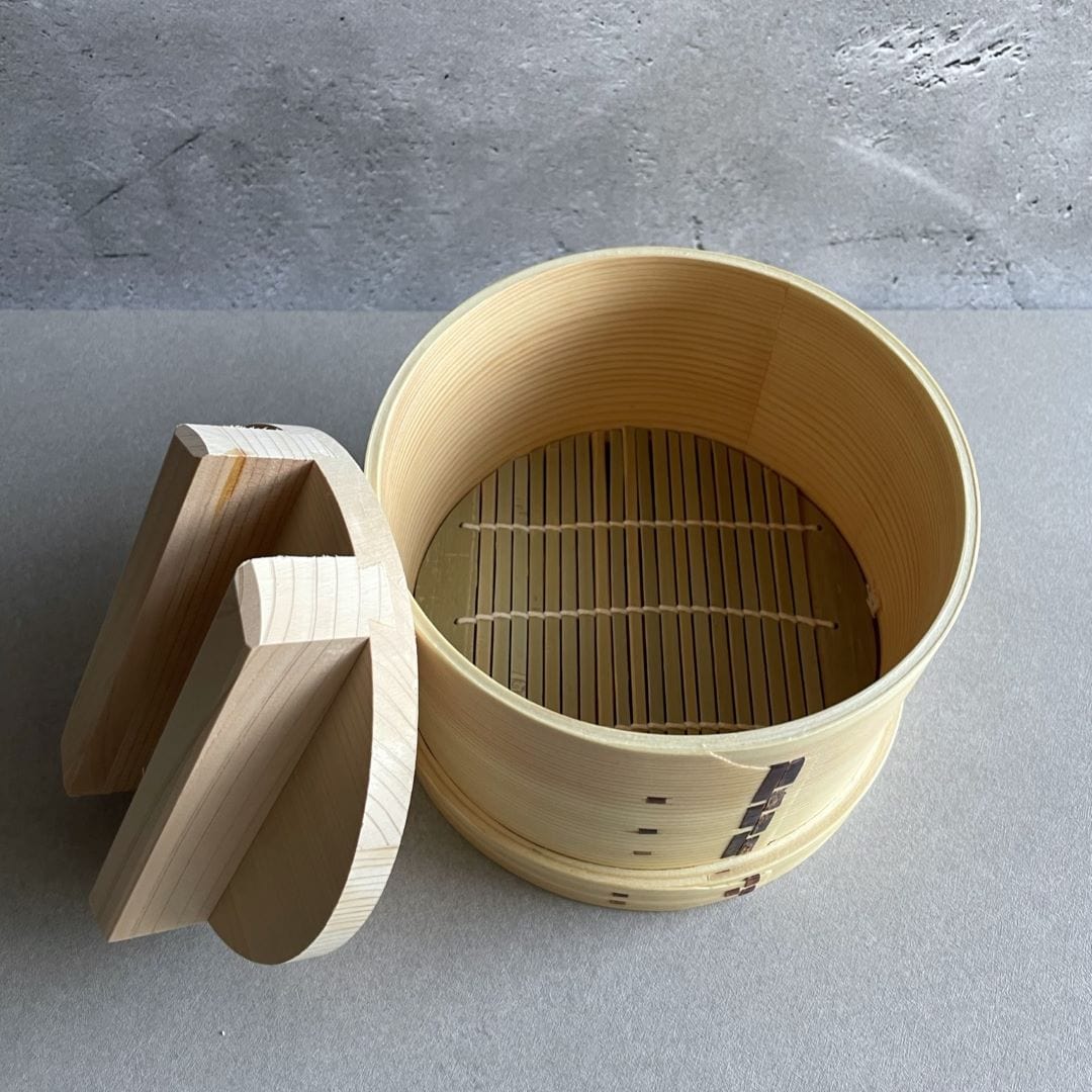 wood tofu maker round shaped container with a bamboo sheet at the bottom a lid on a side of the box