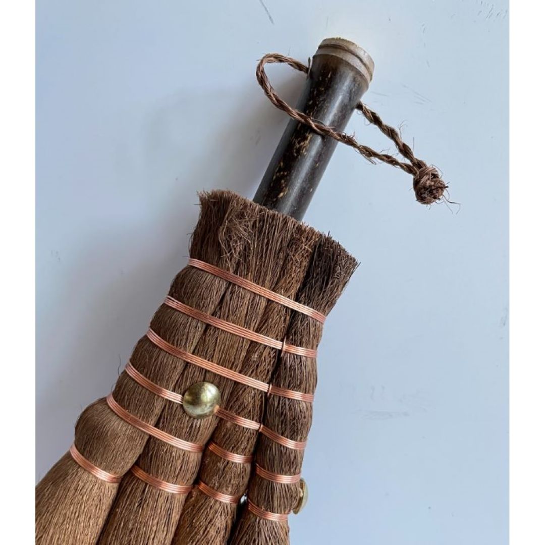 bamboo handle of a hemp broom