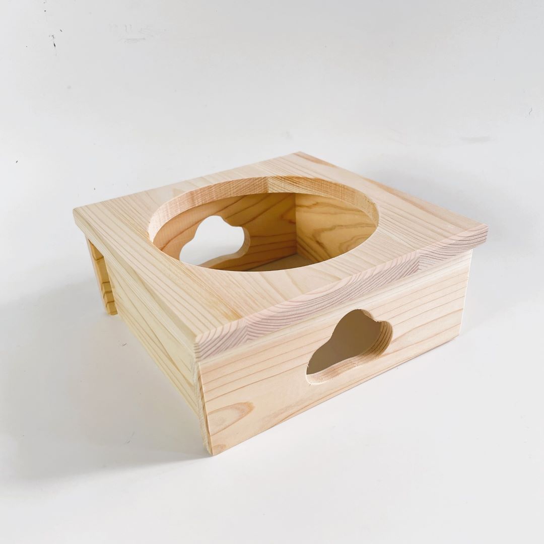 A wooden stand for a rice cooker pot open part on the top and a shape made on one side of the stand