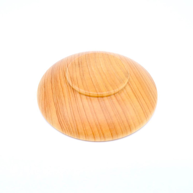 upside down wooden sake cup on white background