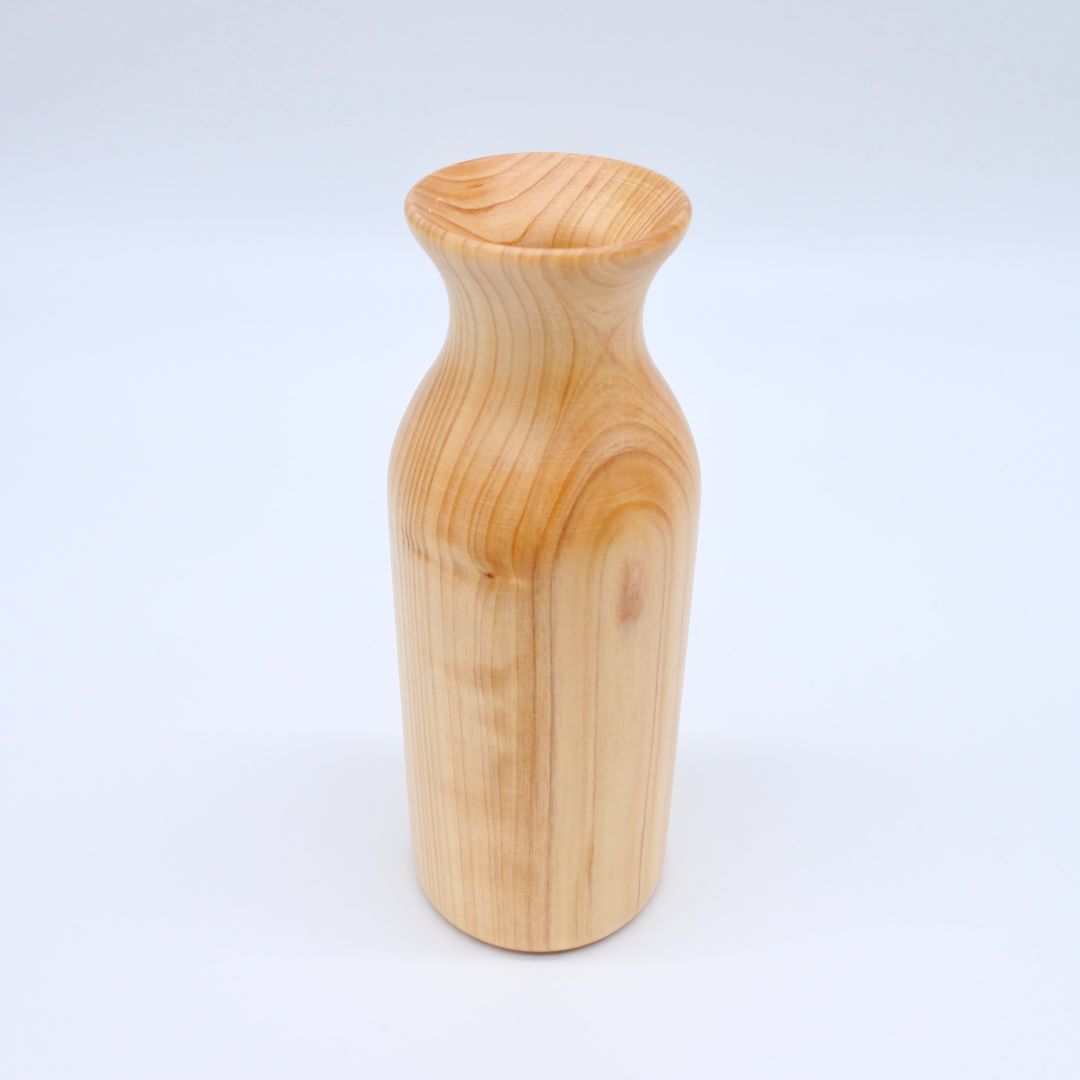 wooden sake bottle stand on a white background
